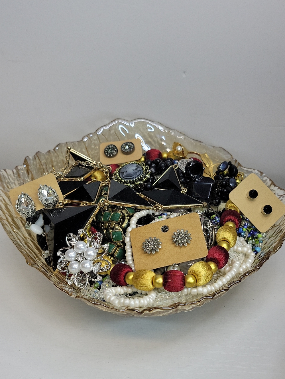 Assorted Jewelry In A Glass Dish